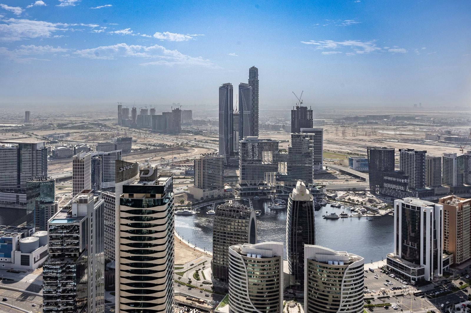 Business Bay towers along the Dubai Water Canal at night