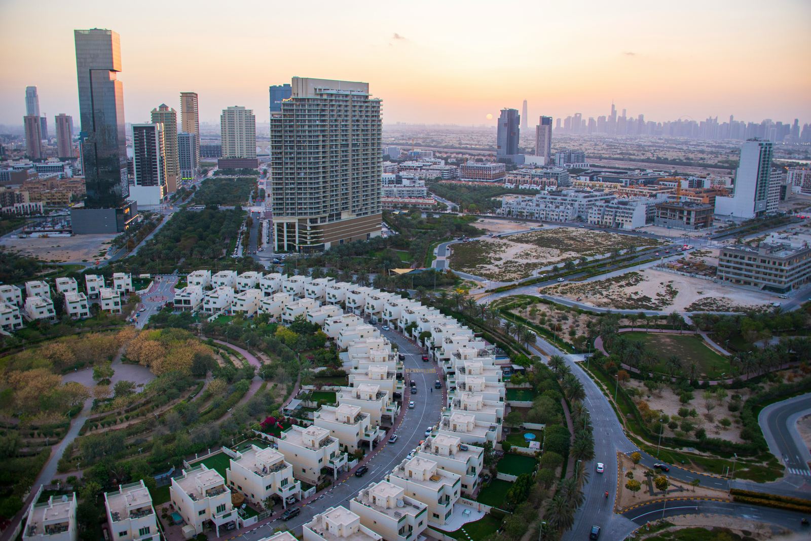Dubai Hills Estate green community with Dubai skyline